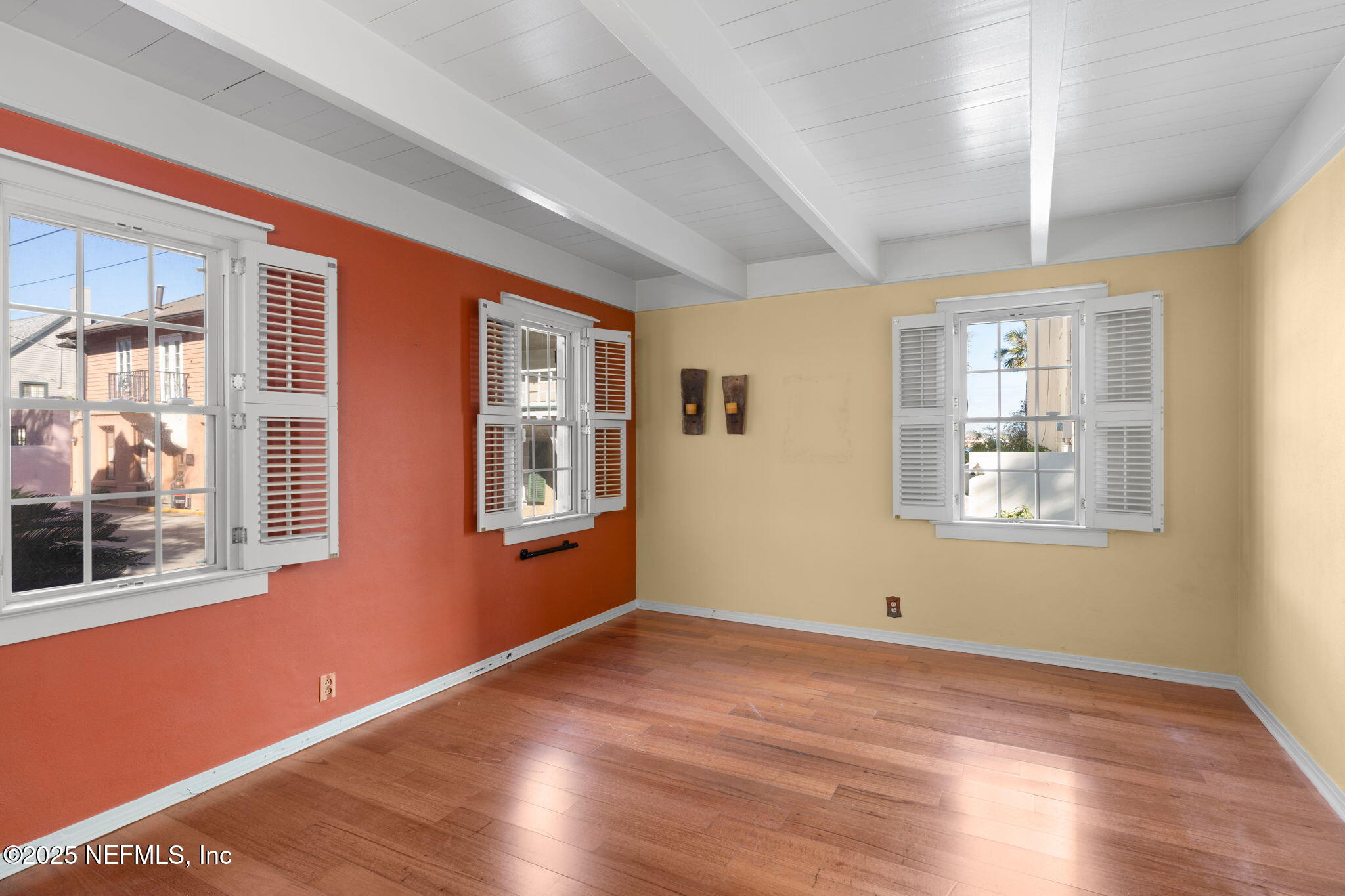 76 Marine Street St. Augustine, FL 32084 - Photo 19 of 60 a view of an empty room with wooden floor and a window