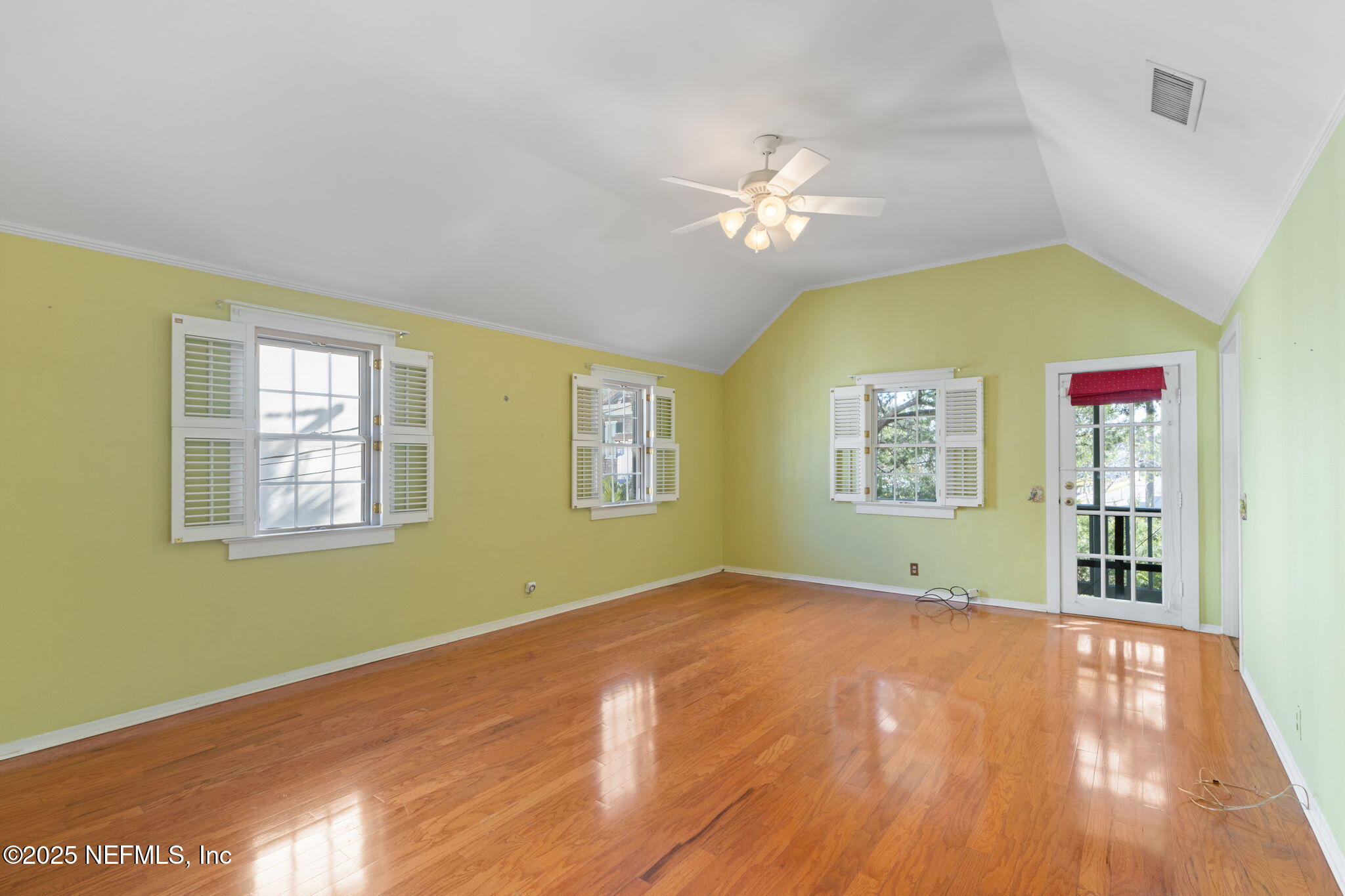 76 Marine Street St. Augustine, FL 32084 - Photo 27 of 60 a view of livingroom with window ceiling fan and hardwood floor