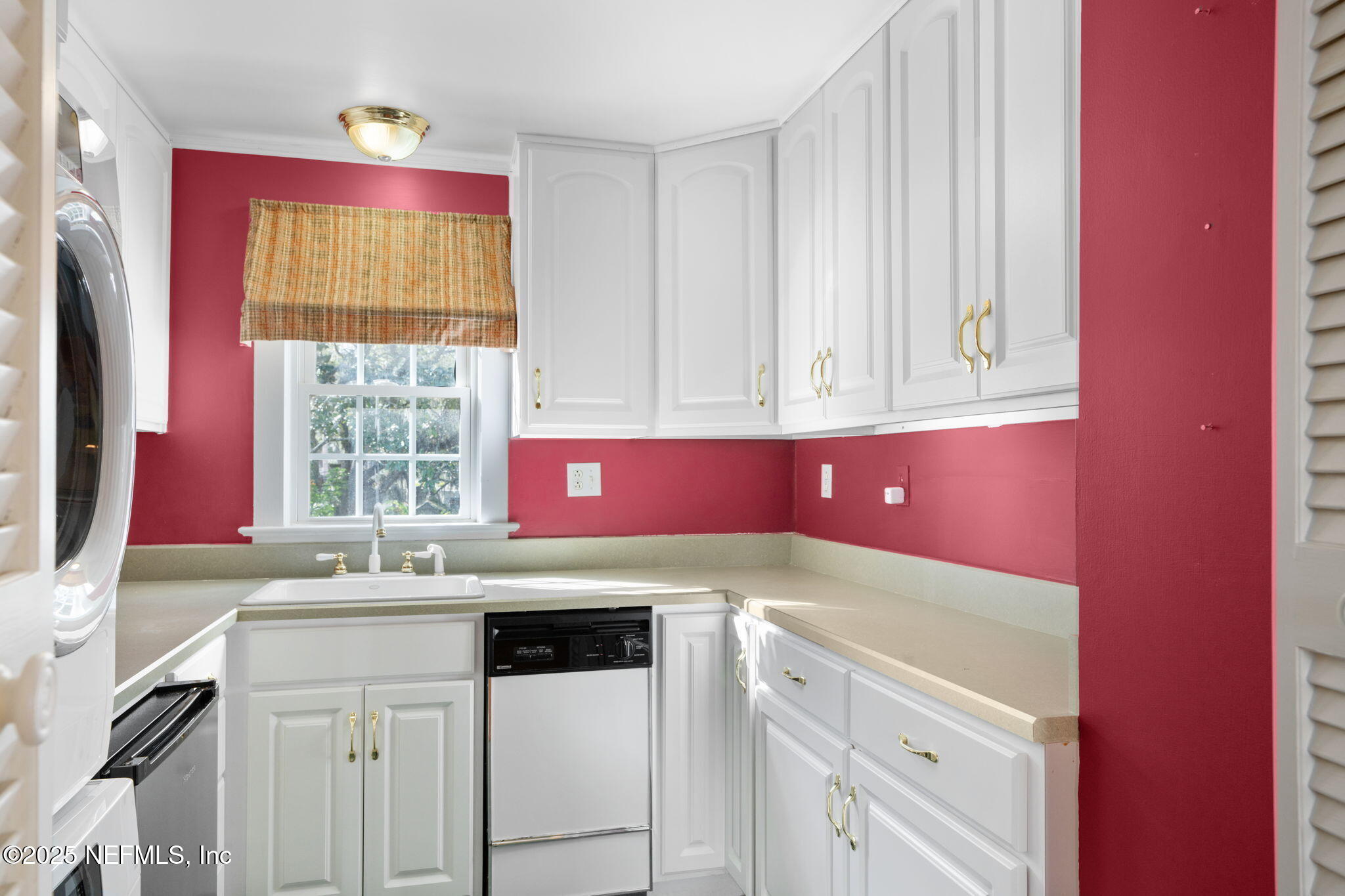 76 Marine Street St. Augustine, FL 32084 - Photo 29 of 60 a kitchen with a sink cabinets and window