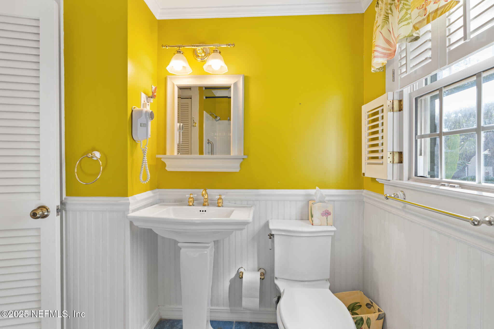 76 Marine Street St. Augustine, FL 32084 - Photo 33 of 60 a bathroom with a sink and a mirror