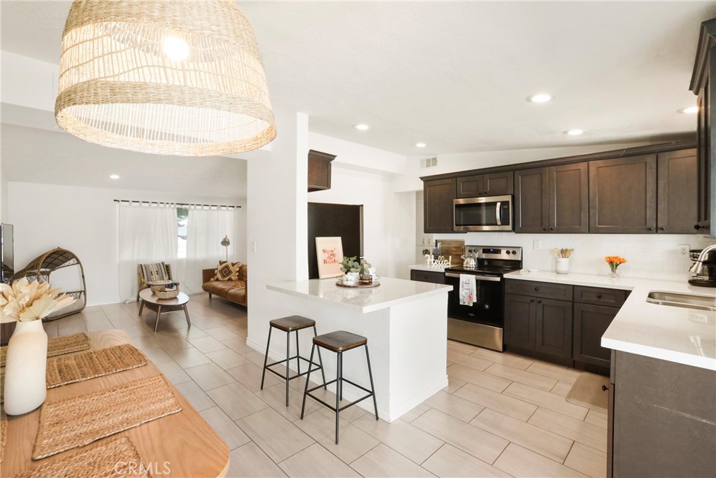 61516 Valley View Drive Joshua Tree, CA 92252 - Photo 12 of 38 a kitchen with sink refrigerator and stove