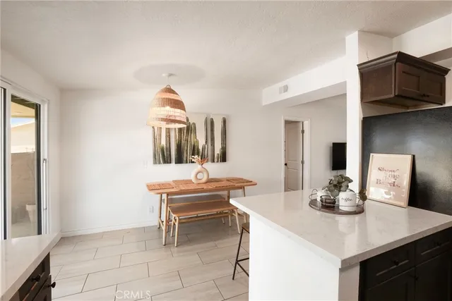 a kitchen with a sink cabinets and window