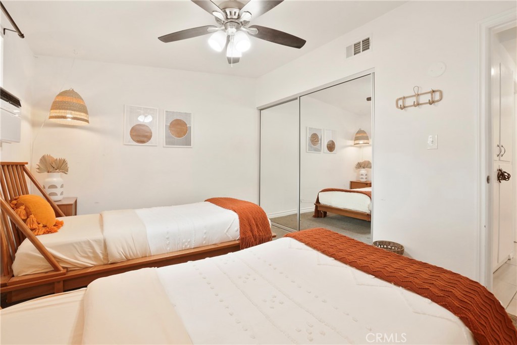 61516 Valley View Drive Joshua Tree, CA 92252 - Photo 20 of 38 a bedroom with two beds and painted walls