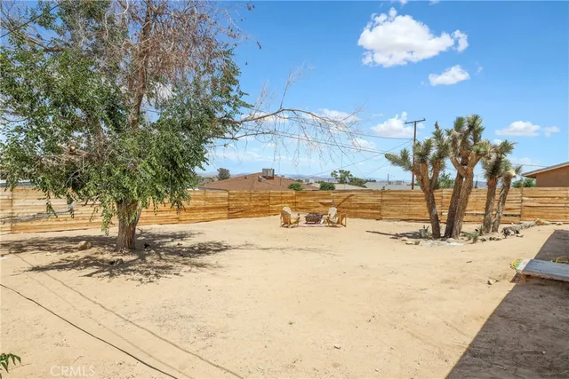a view of a backyard of the house