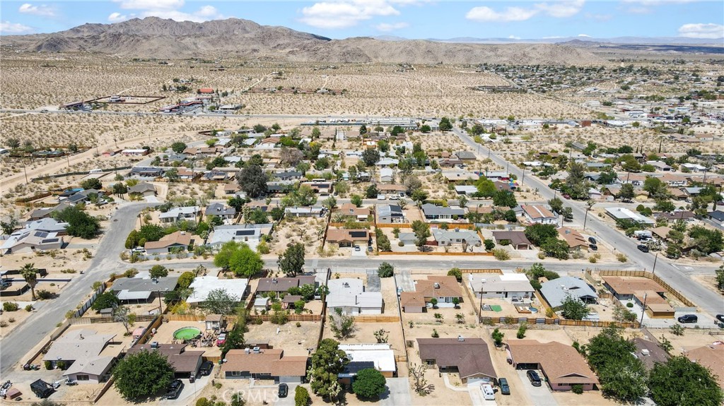61516 Valley View Drive Joshua Tree, CA 92252 - Photo 35 of 38 an aerial view of residential building and parking space