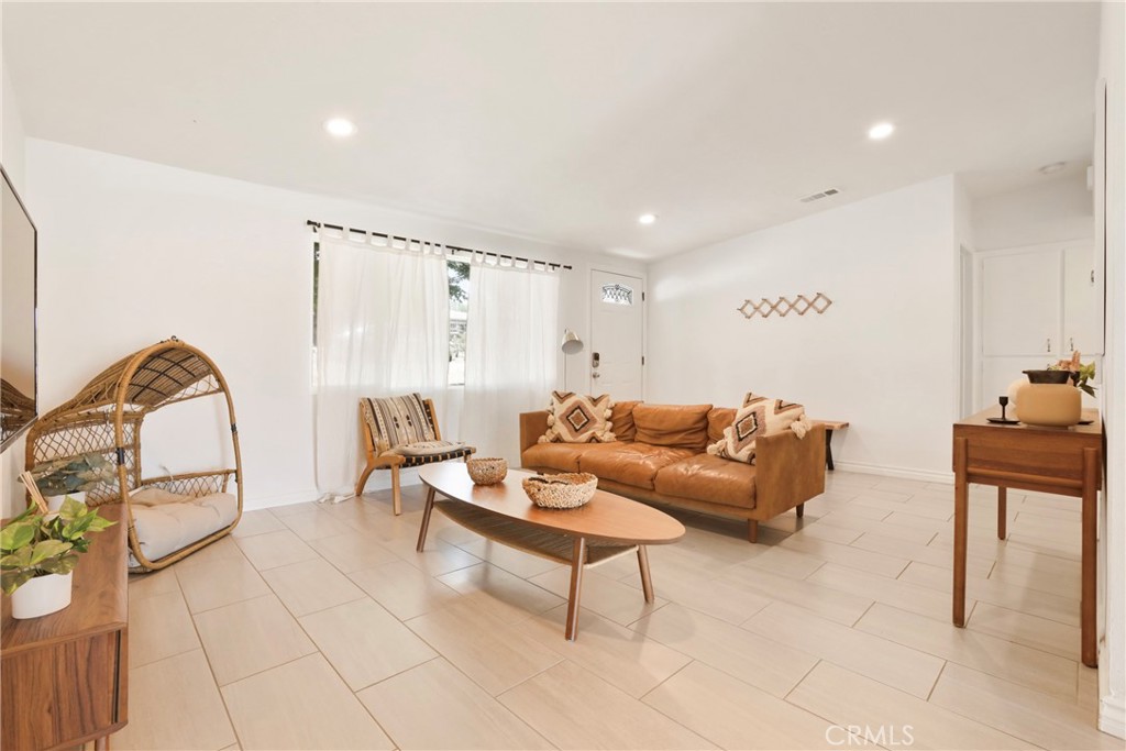 61516 Valley View Drive Joshua Tree, CA 92252 - Photo 6 of 38 a living room with furniture a rug and white walls