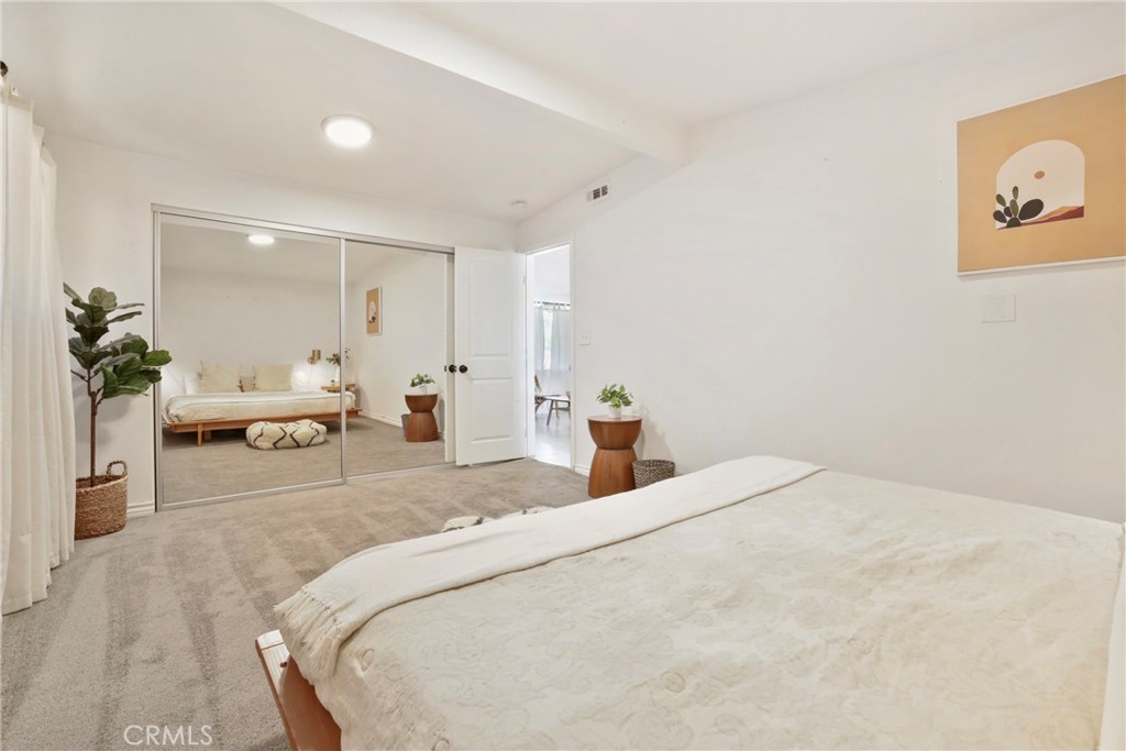 61516 Valley View Drive Joshua Tree, CA 92252 - Photo 10 of 38 a bedroom with a bed and a couch