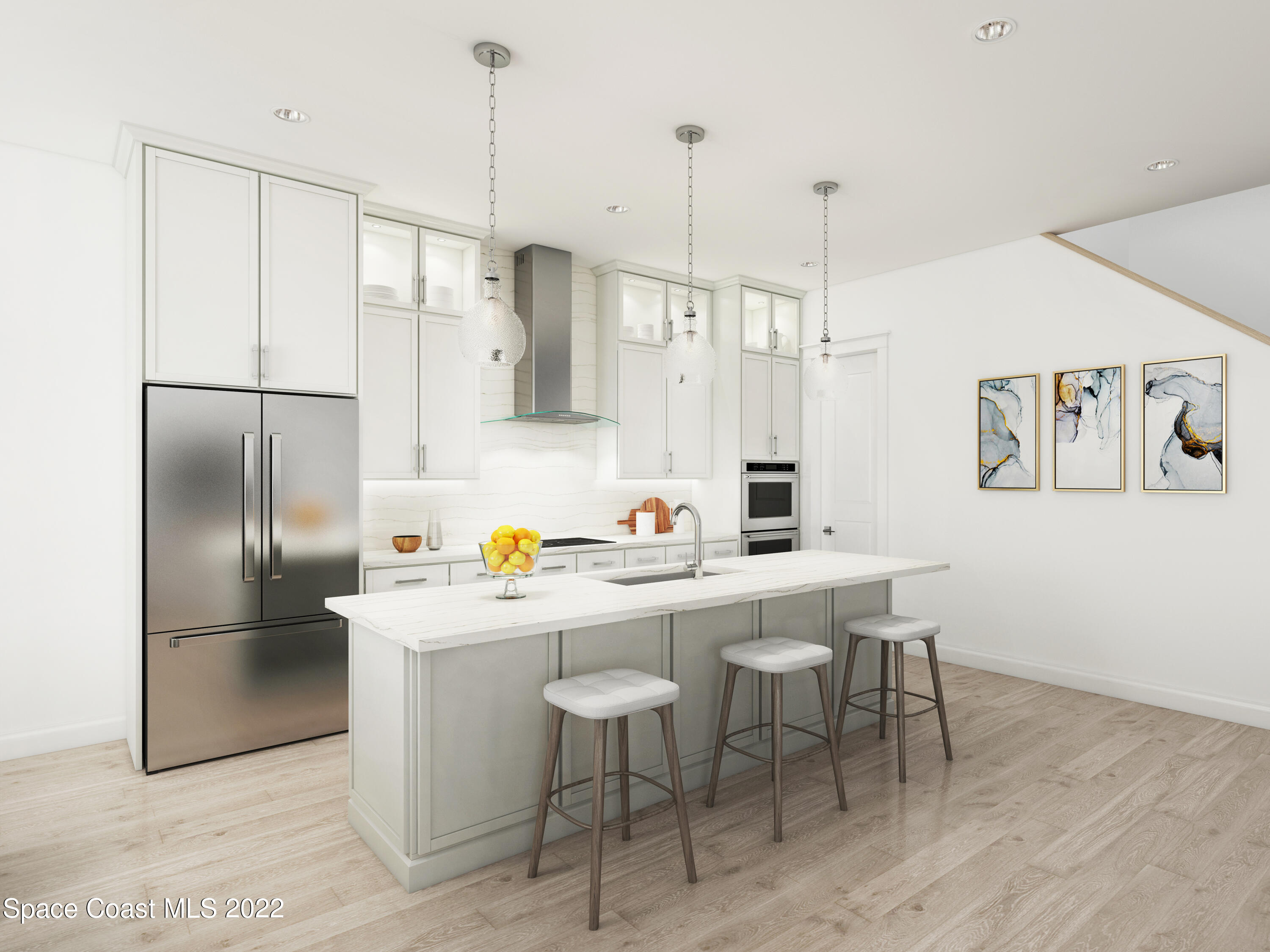 109 Watson Drive Indialantic, FL 32903 - Photo 3 of 5 a kitchen with stainless steel appliances a refrigerator a sink a dining table and chairs