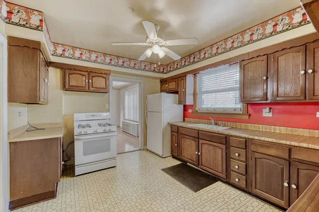 a kitchen with stainless steel appliances granite countertop a sink and cabinets