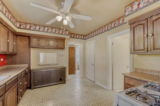 a kitchen with stainless steel appliances granite countertop a stove and a refrigerator