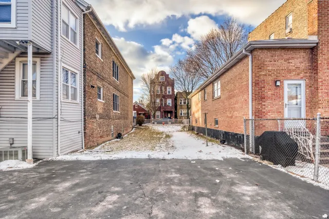 a view of a street with a building in the background