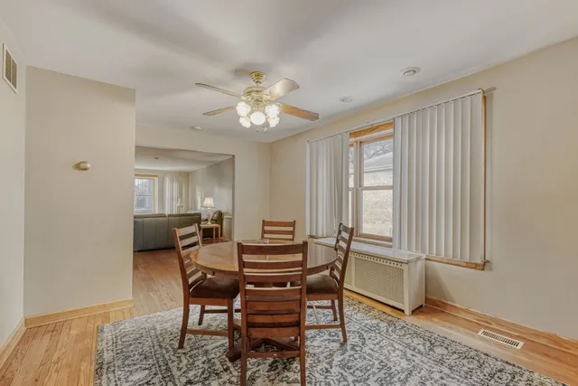 a dining room with furniture and window
