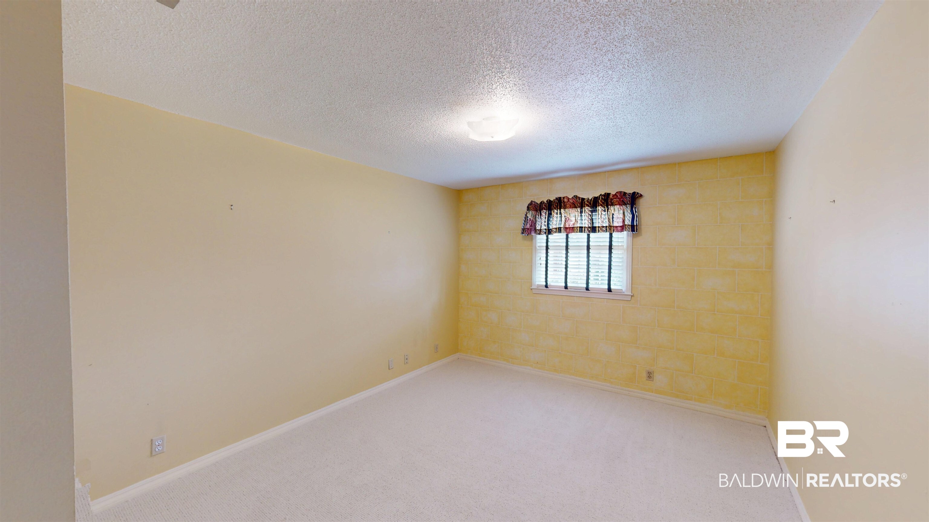 609 Burlington Court Mobile, AL 36608 - Photo 14 of 19 Carpeted spare room with a textured ceiling and baseboards