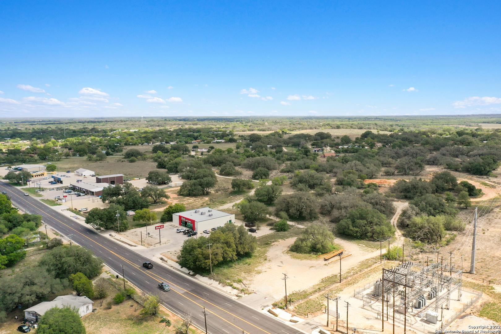 0 Rossville Road Devine, TX 78016 - Photo 4 of 12 an aerial view of residential houses with outdoor space and seating