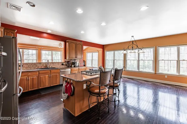 a view of a dining room with furniture and wooden floor