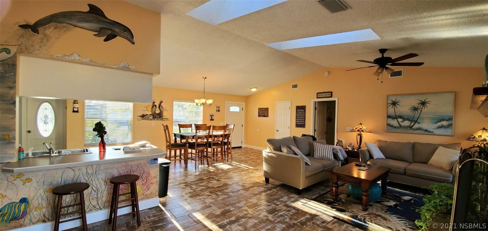 2219 Umbrella Tree Drive Edgewater, FL 32141 - Photo 15 of 45 a living room with lots of furniture and a chandelier