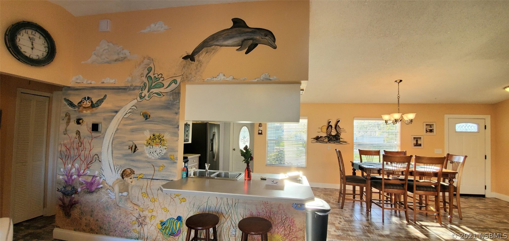 2219 Umbrella Tree Drive Edgewater, FL 32141 - Photo 32 of 45 a kitchen with a table and chairs