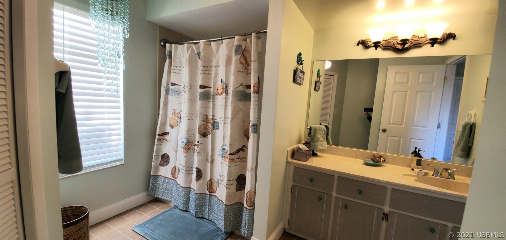 2219 Umbrella Tree Drive Edgewater, FL 32141 - Photo 36 of 45 a bathroom with a double vanity sink mirror and shower