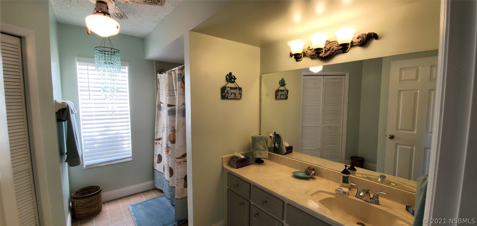 2219 Umbrella Tree Drive Edgewater, FL 32141 - Photo 37 of 45 a bathroom with a sink vanity granite tub and shower