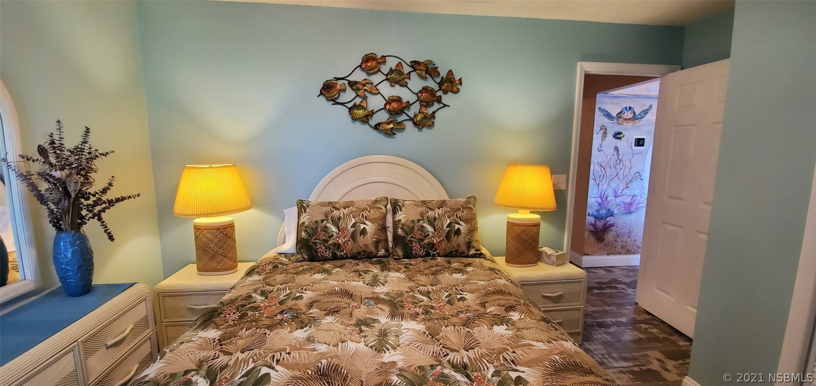 2219 Umbrella Tree Drive Edgewater, FL 32141 - Photo 44 of 45 a bedroom with a bed and a painting on the wall