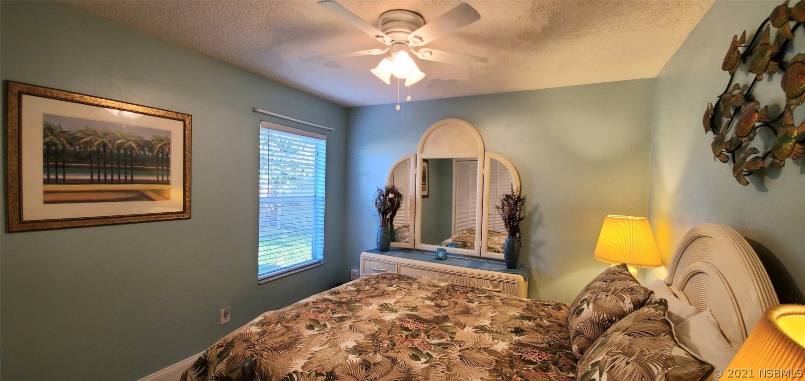 2219 Umbrella Tree Drive Edgewater, FL 32141 - Photo 45 of 45 a bedroom with a bed and a chandelier