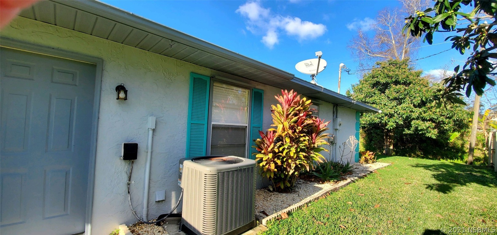 2219 Umbrella Tree Drive Edgewater, FL 32141 - Photo 9 of 45 a front view of a house with a yard