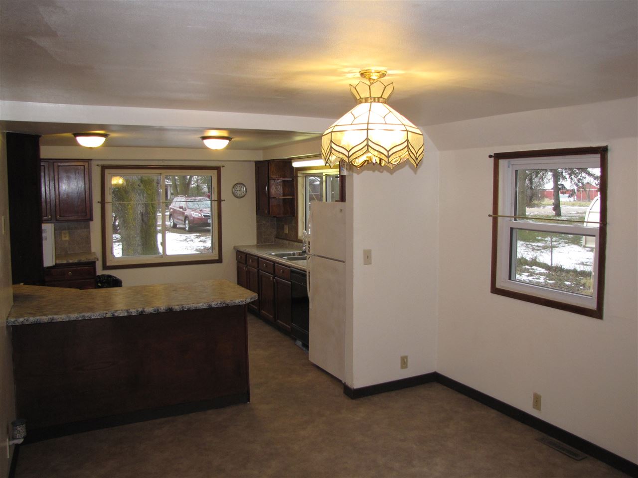 3634 Rotary Road Rockford, IL 61109 - Photo 5 of 18 a view of a kitchen with granite countertop stainless steel appliances and a chandelier