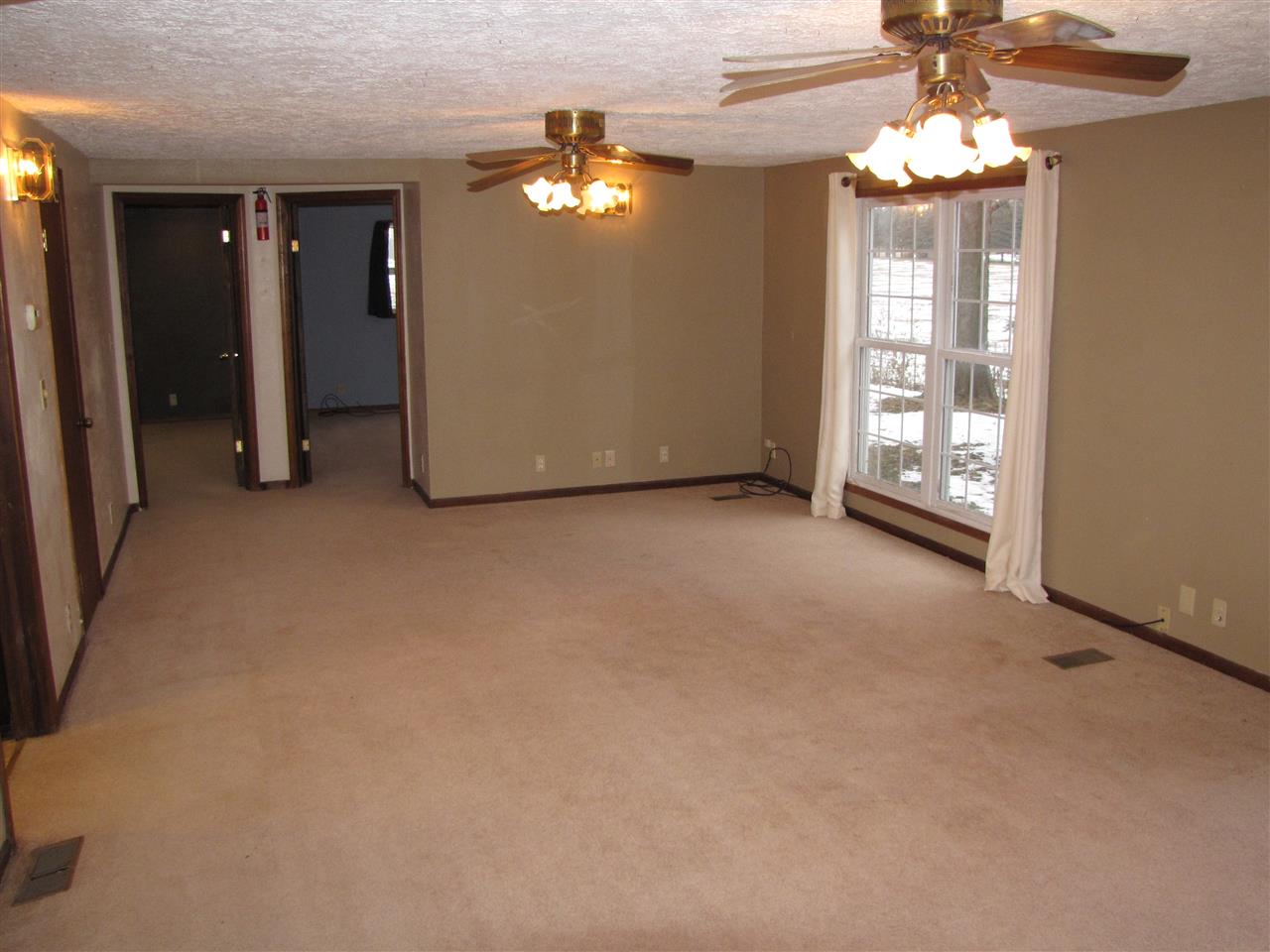 3634 Rotary Road Rockford, IL 61109 - Photo 9 of 18 an empty room with chandelier fan
