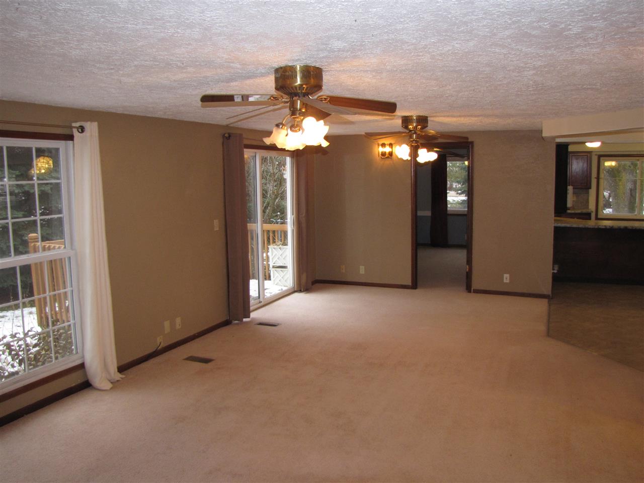 3634 Rotary Road Rockford, IL 61109 - Photo 10 of 18 a view of a livingroom with a ceiling fan and window
