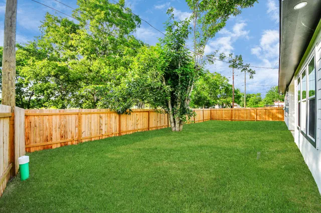 a view of yard with grass and a trees