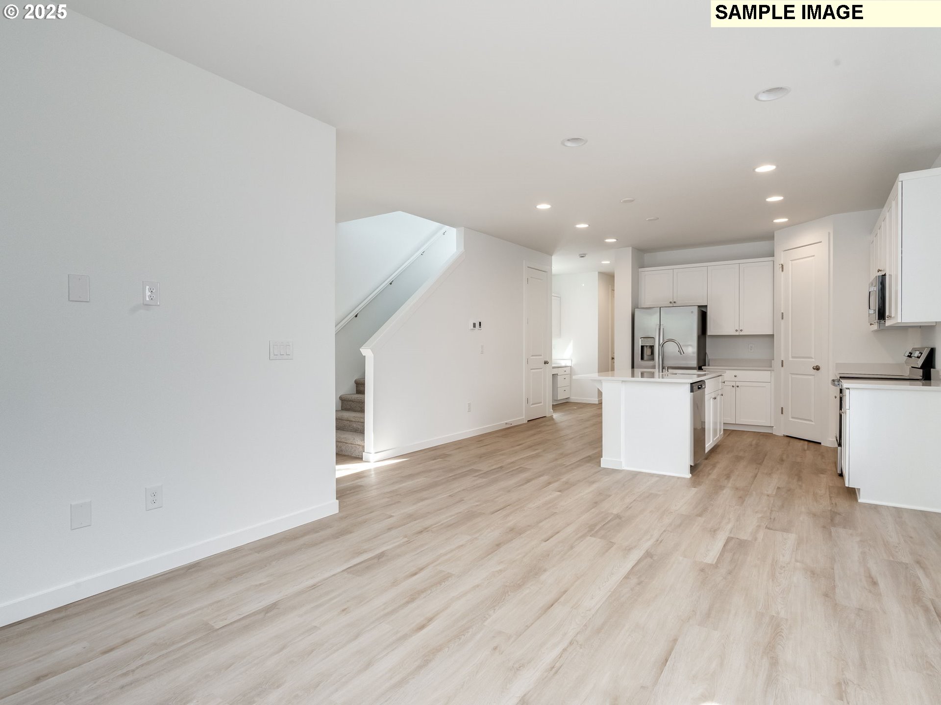 2307 Southwest 5th Circle Battle Ground, WA 98604 - Photo 11 of 21 a view of a kitchen with wooden floor and windows