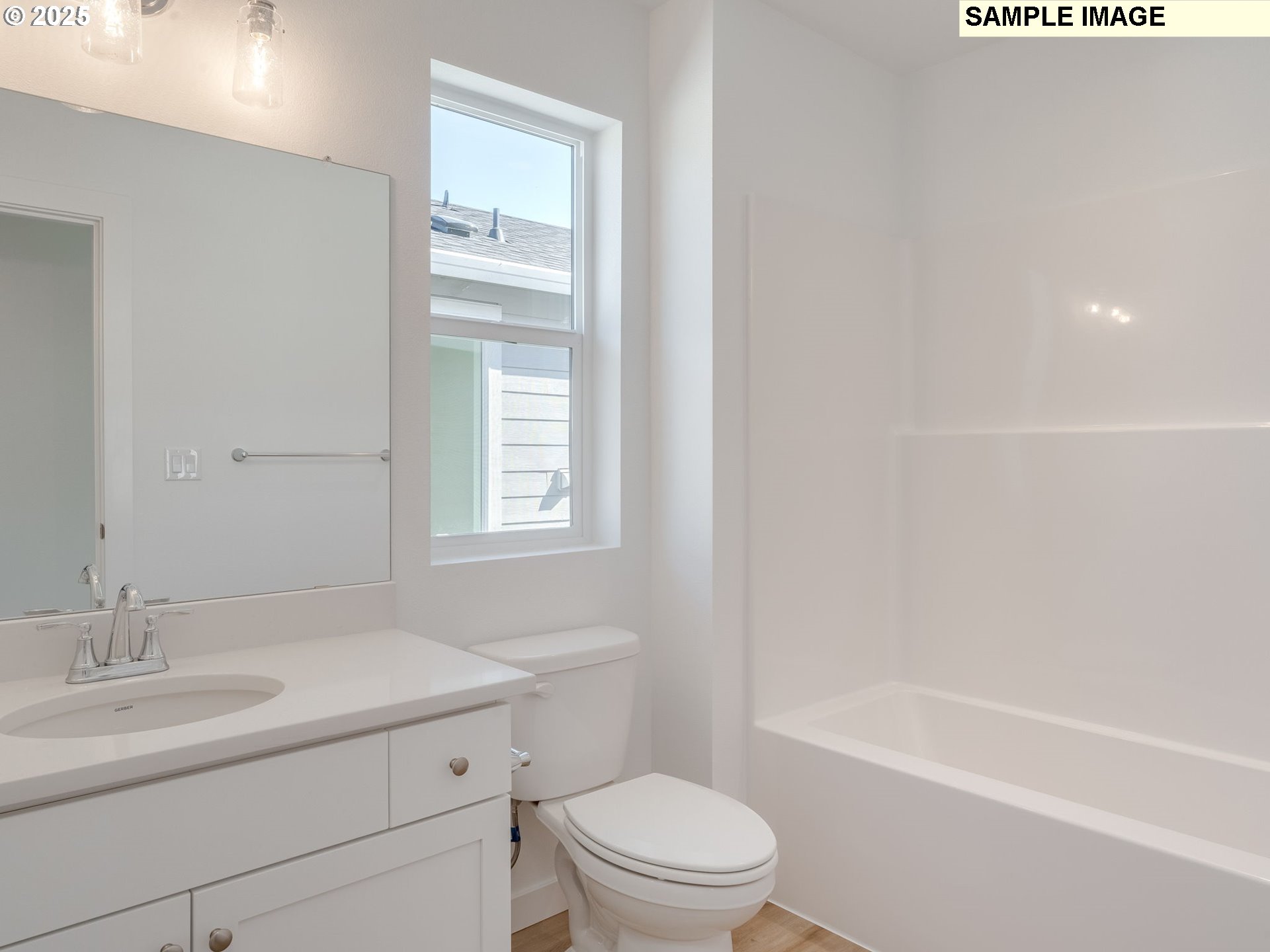 2307 Southwest 5th Circle Battle Ground, WA 98604 - Photo 16 of 21 a bathroom with a bathtub shower sink vanity mirror and toilet
