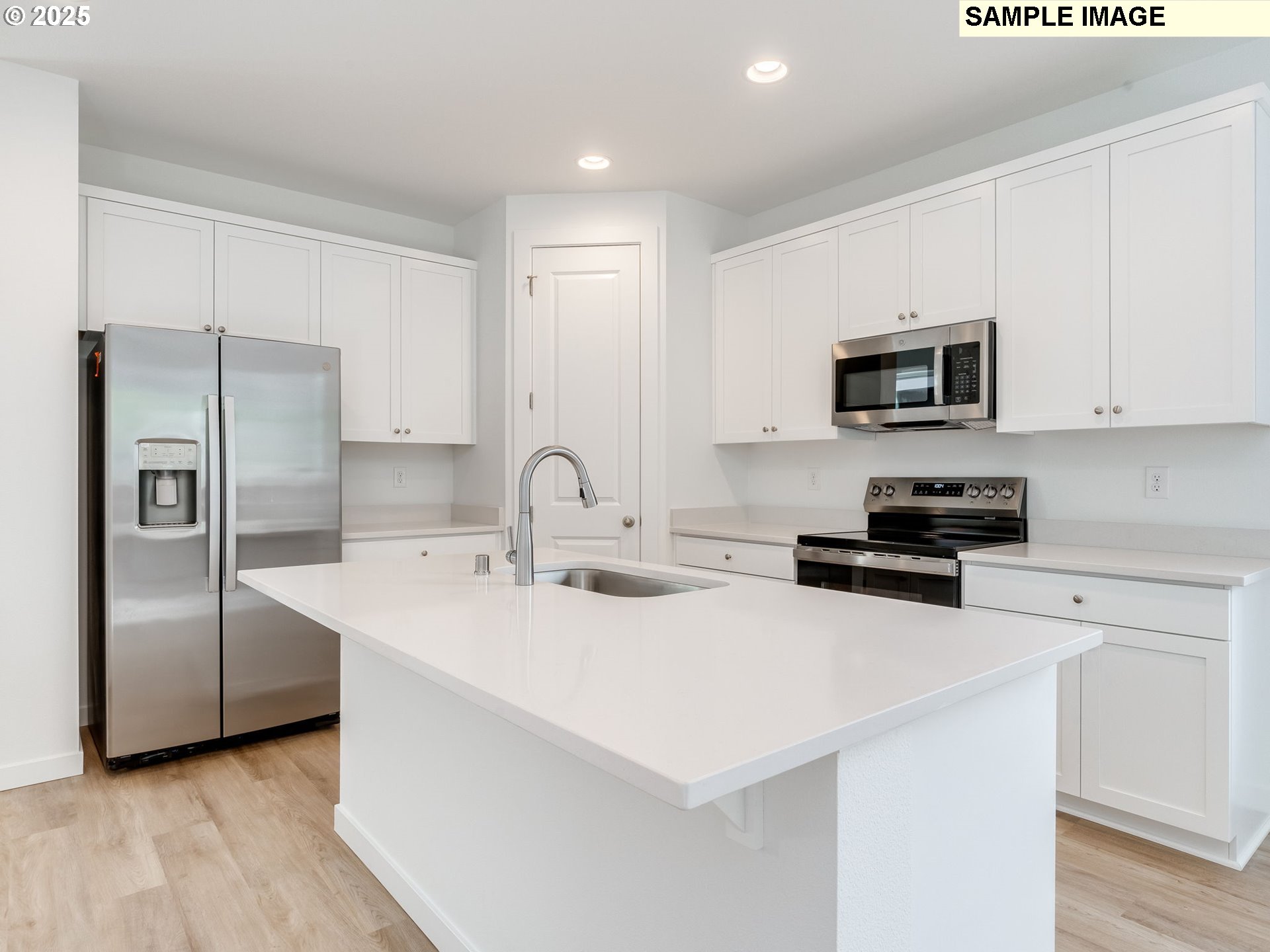 2307 Southwest 5th Circle Battle Ground, WA 98604 - Photo 8 of 21 a kitchen with stainless steel appliances a refrigerator sink and microwave