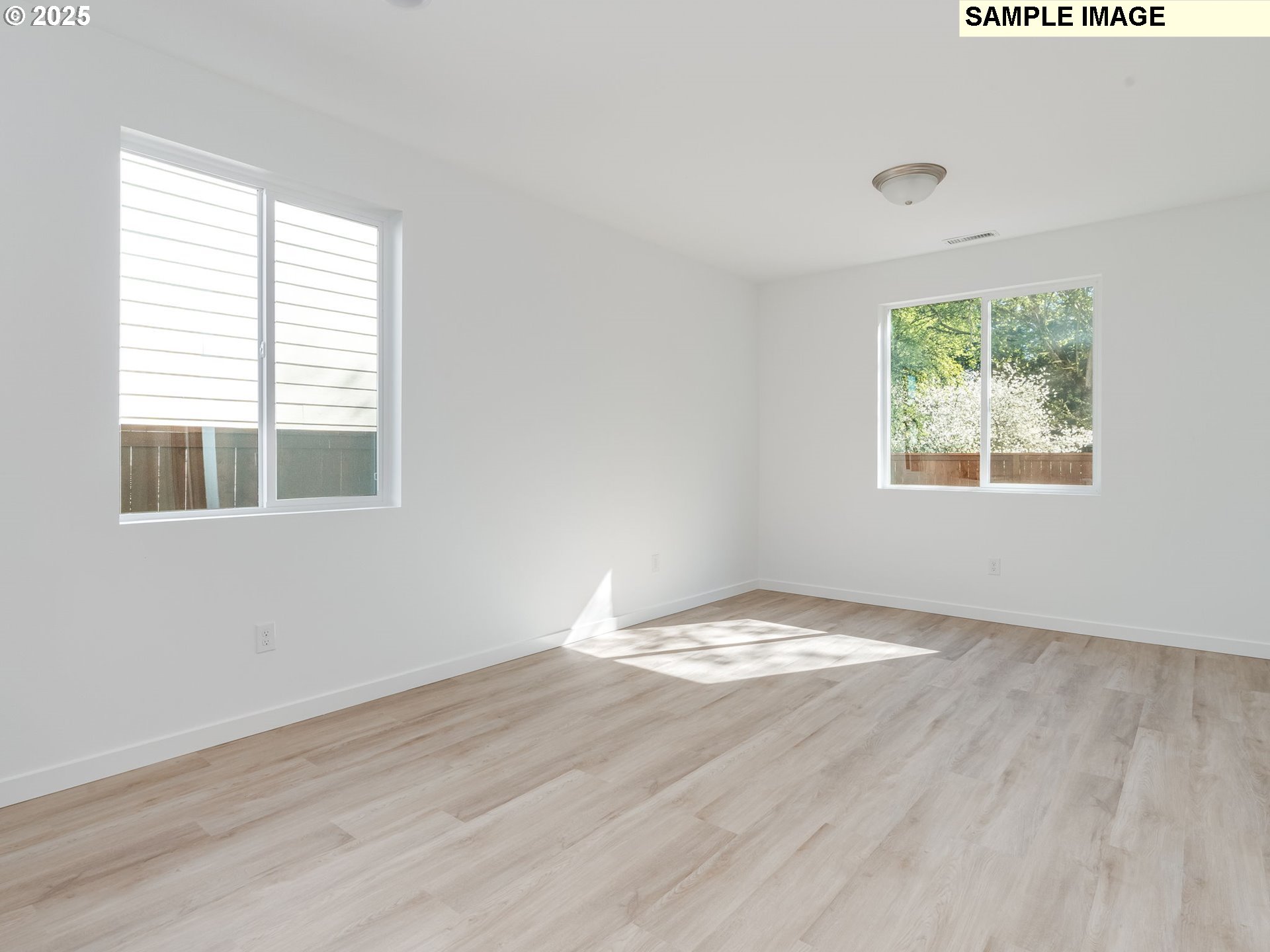 2307 Southwest 5th Circle Battle Ground, WA 98604 - Photo 9 of 21 a view of an empty room with wooden floor and a window