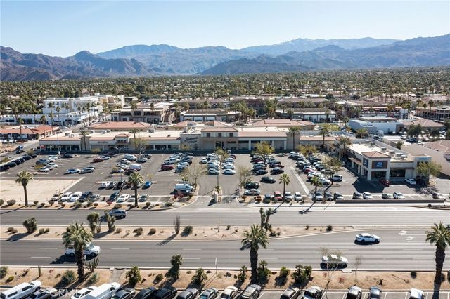 an aerial view of a city and mountain