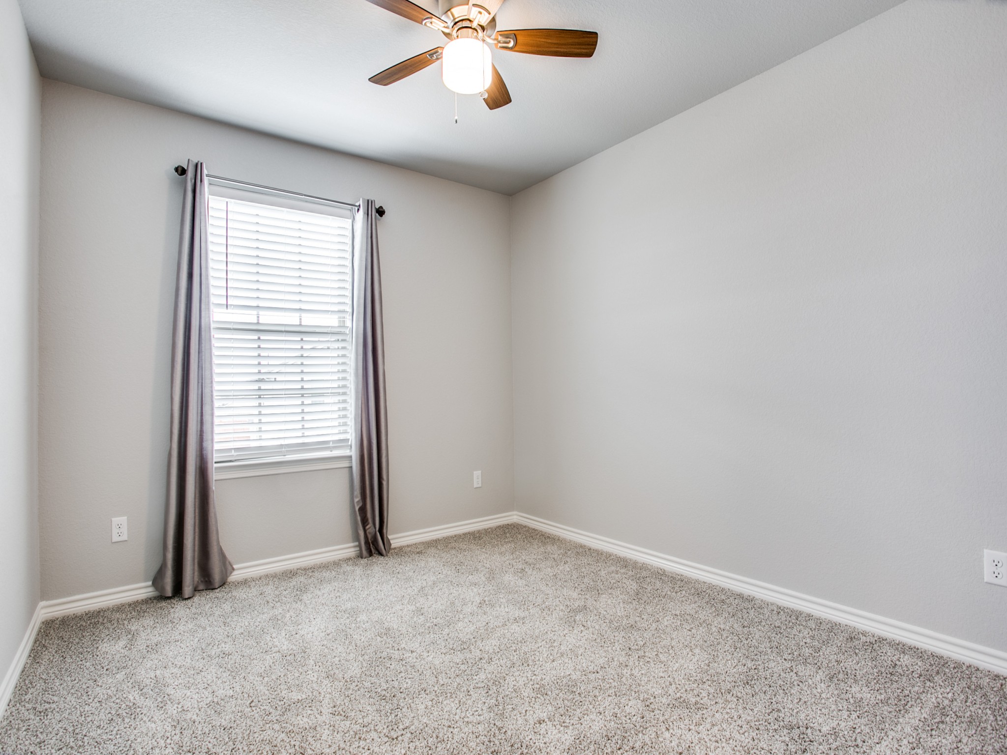 508 Rearing Mare Pass Georgetown, TX 78626 - Photo 11 of 26 Secondary bedroom featuring ceiling fan, carpet flooring, and baseboards