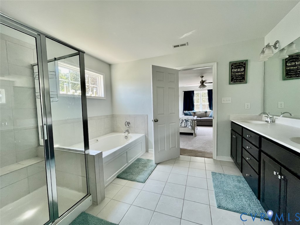 9506 Simonsville Road Midlothian, VA 23112 - Photo 17 of 27 a bathroom with a bathtub and a sink