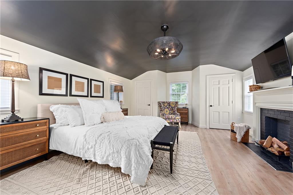 607 Davis Lane Sewickley, PA 15143 - Photo 22 of 43 a spacious bedroom with a bed dresser and a flat screen tv