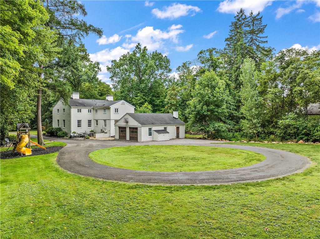 607 Davis Lane Sewickley, PA 15143 - Photo 41 of 43 a view of white house with a big yard and large trees