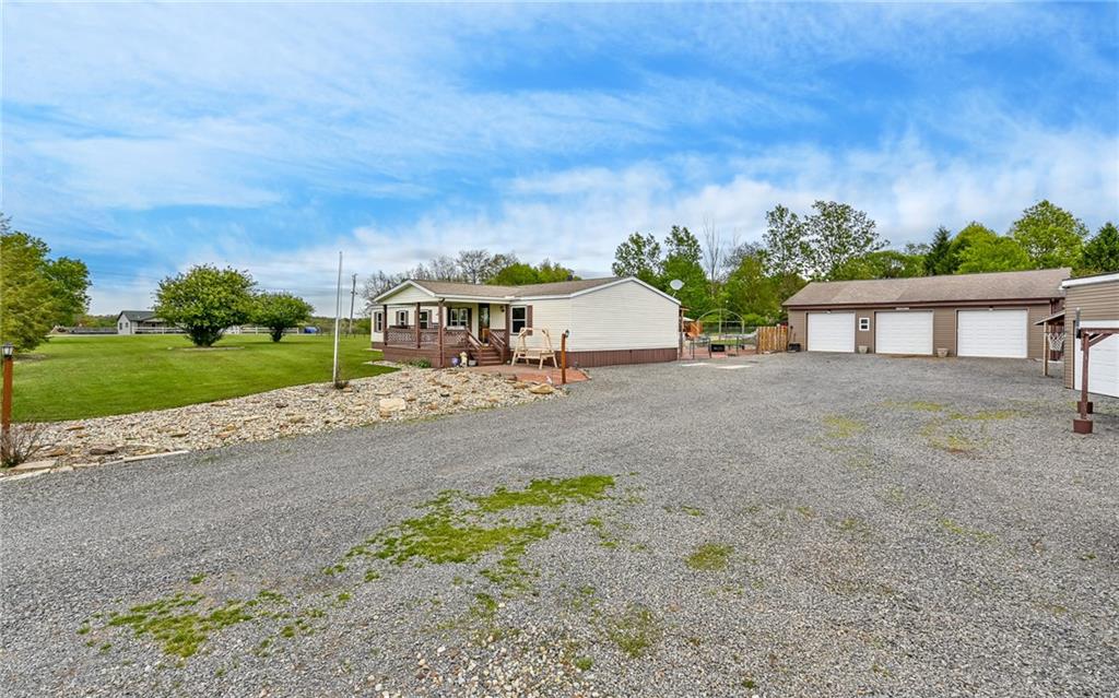 307 Hungarian Road Slippery Rock, PA 16057 - Photo 21 of 34 a view of house with outdoor space and car parked