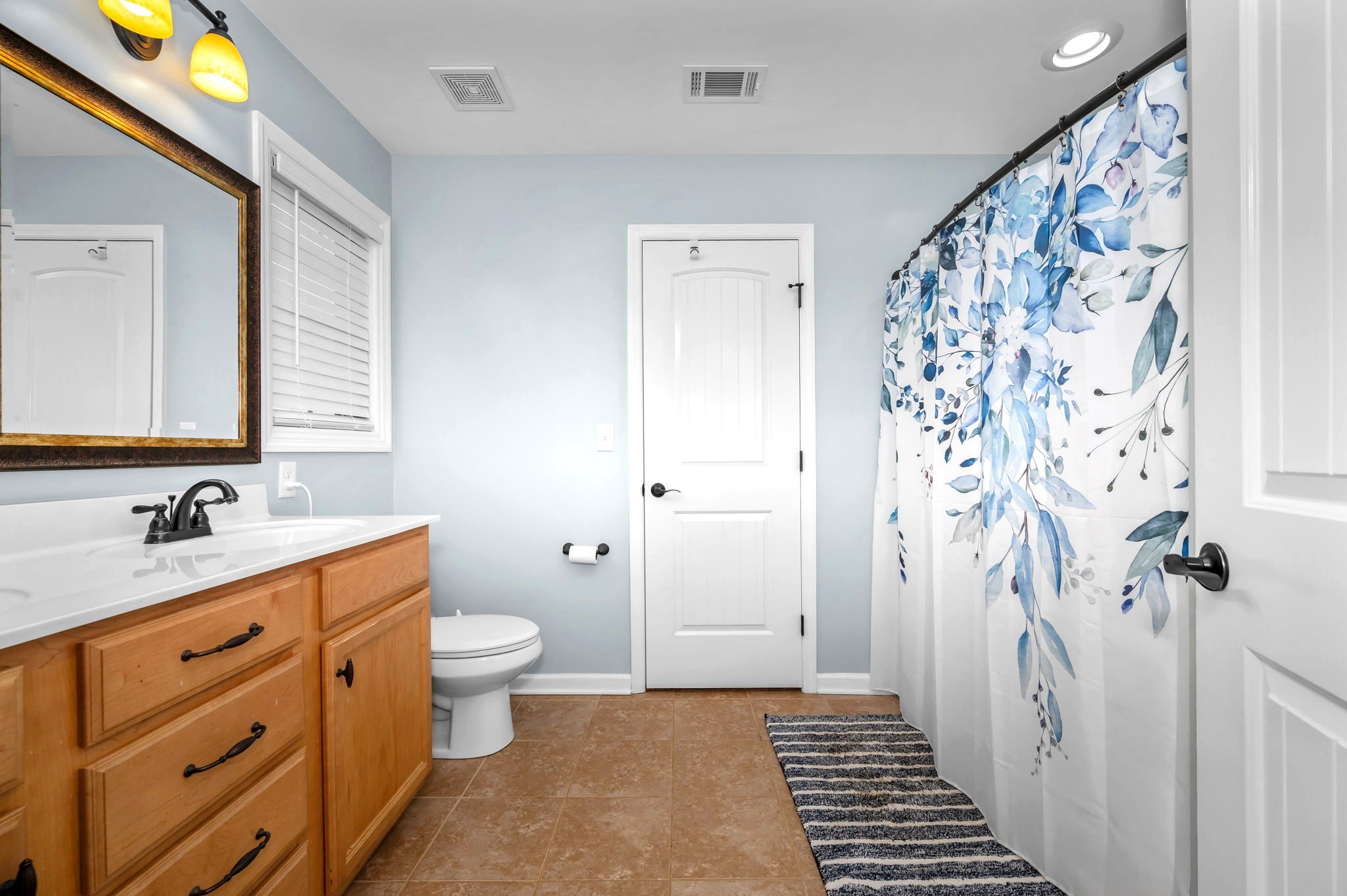 4232 Zephyr Court Murfreesboro, TN 37128 - Photo 14 of 26 a bathroom with a sink a toilet a shower and a mirror