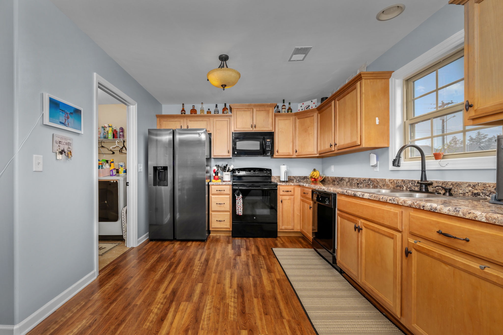4232 Zephyr Court Murfreesboro, TN 37128 - Photo 8 of 26 a kitchen with granite countertop a refrigerator stove top oven and sink