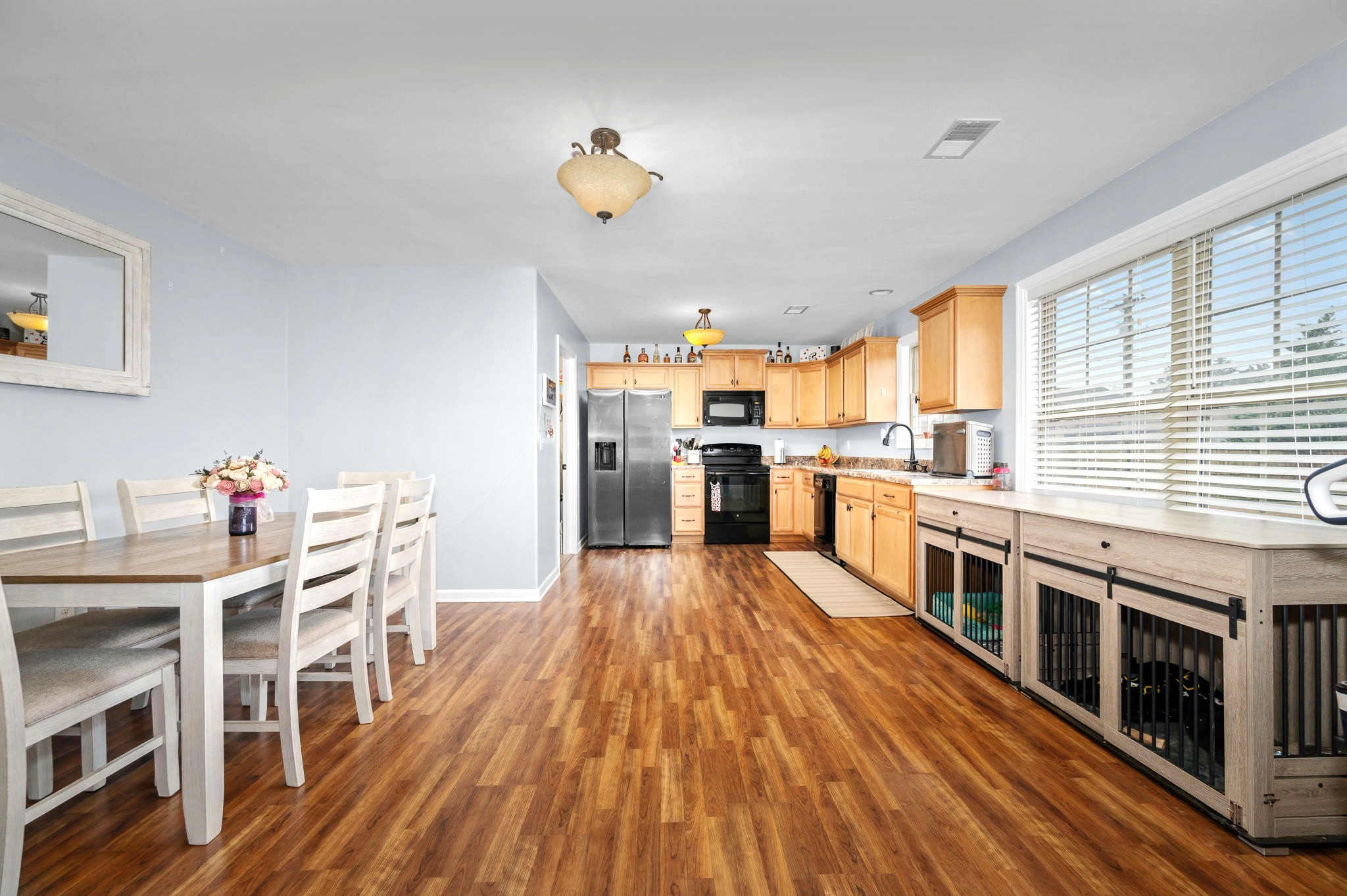 4232 Zephyr Court Murfreesboro, TN 37128 - Photo 9 of 26 a kitchen with stainless steel appliances kitchen island wooden floors and center island