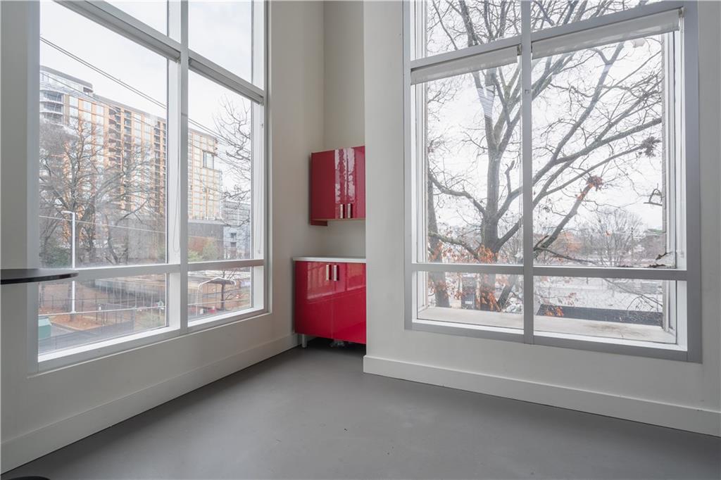 692 10th Street Northwest Atlanta, GA 30318 - Photo 22 of 38 a view of an empty room with a window