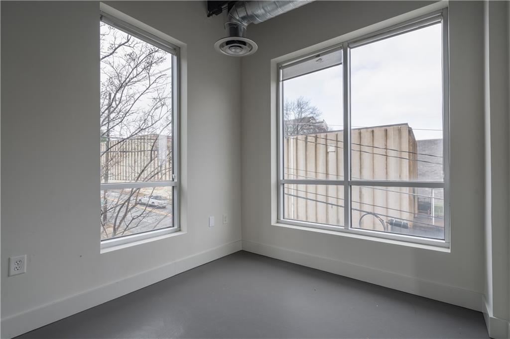 692 10th Street Northwest Atlanta, GA 30318 - Photo 23 of 38 a view of an empty room and window
