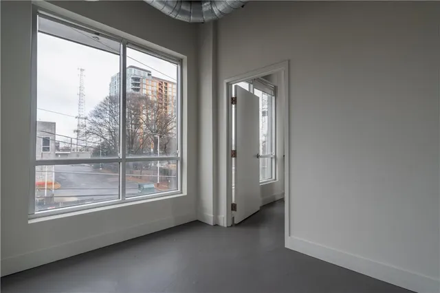 wooden floor in an empty room and a window