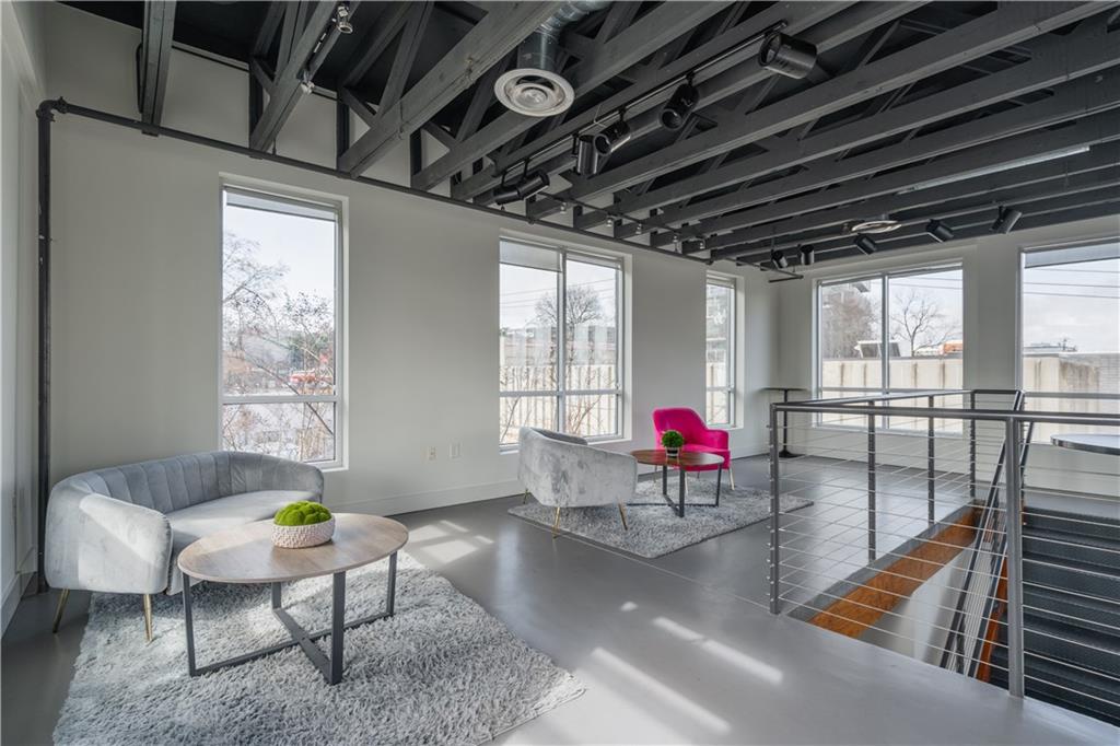 692 10th Street Northwest Atlanta, GA 30318 - Photo 29 of 38 a living room with furniture and a floor to ceiling window