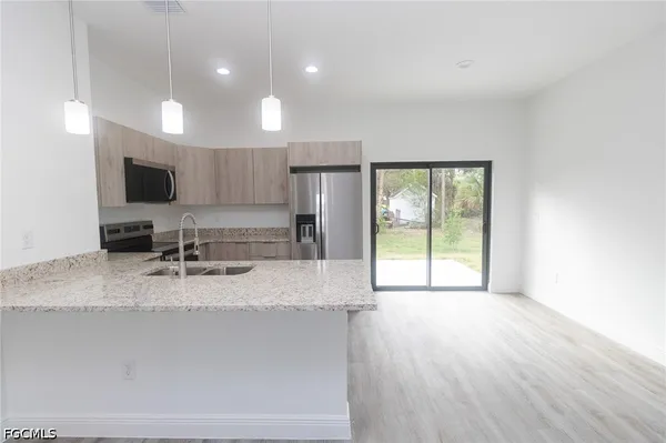 a large kitchen with a large window