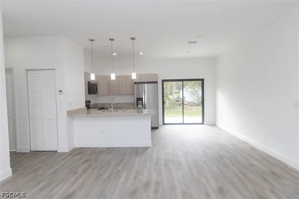 a view of kitchen and kitchen with furniture