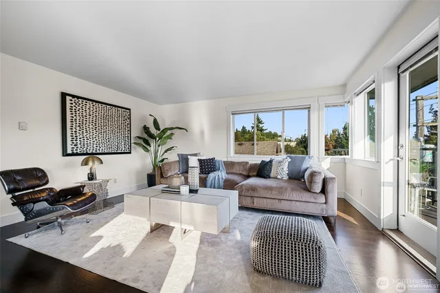 a living room with furniture rug and window